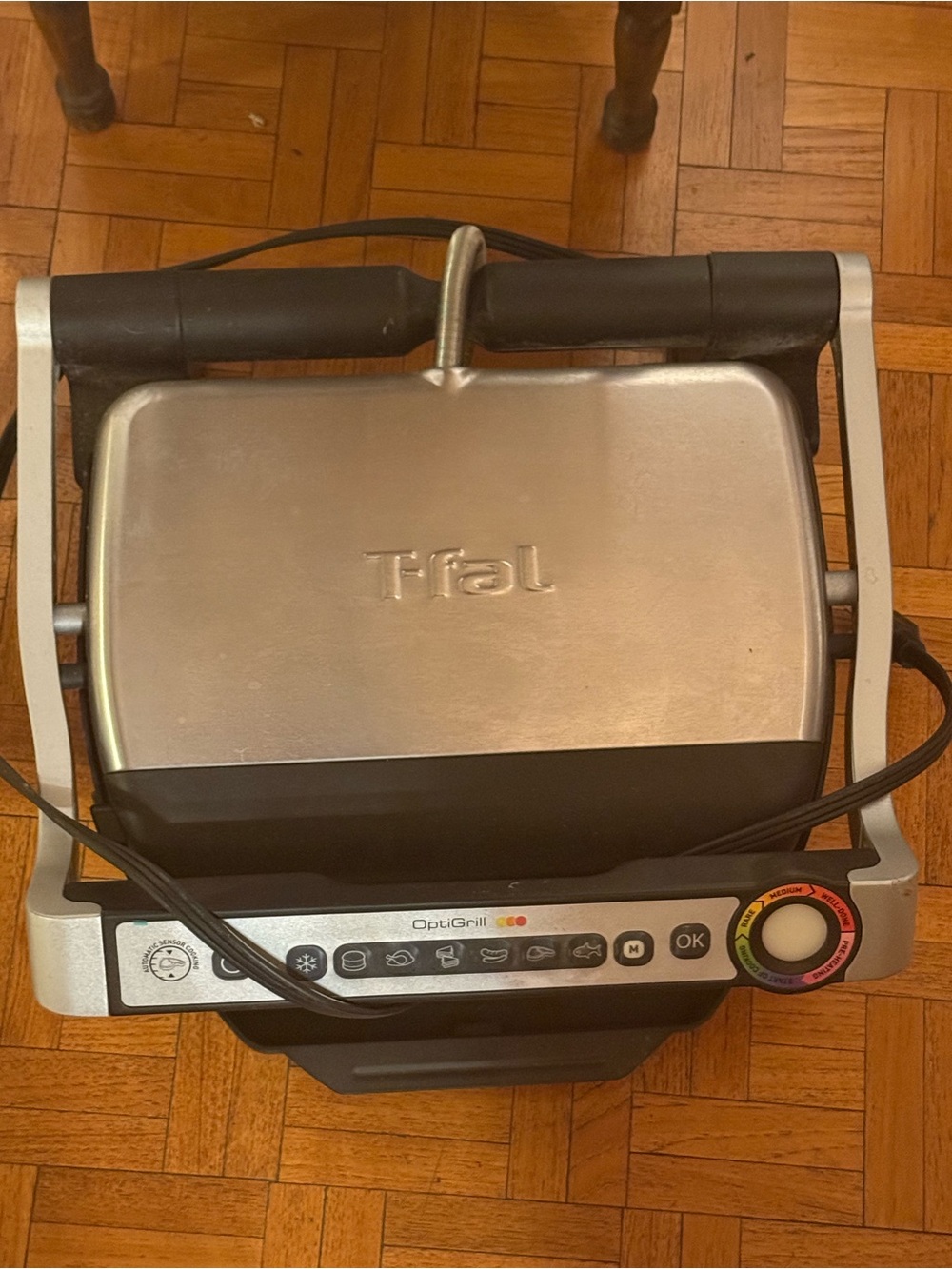 a T-fal OptiGrill indoor meat grill, model SERIE 8351 s1.It operates at 1800W